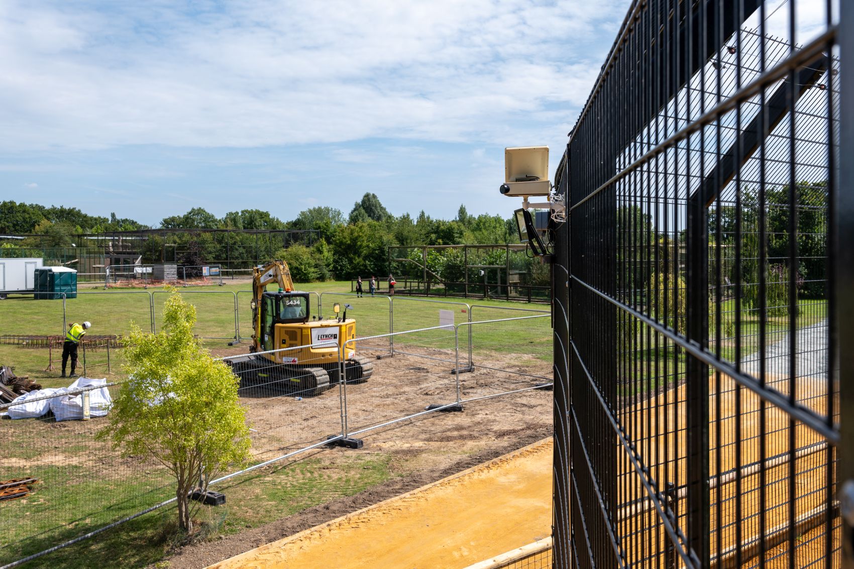 Solar-powered construction timelapse camera mounted on an active building site