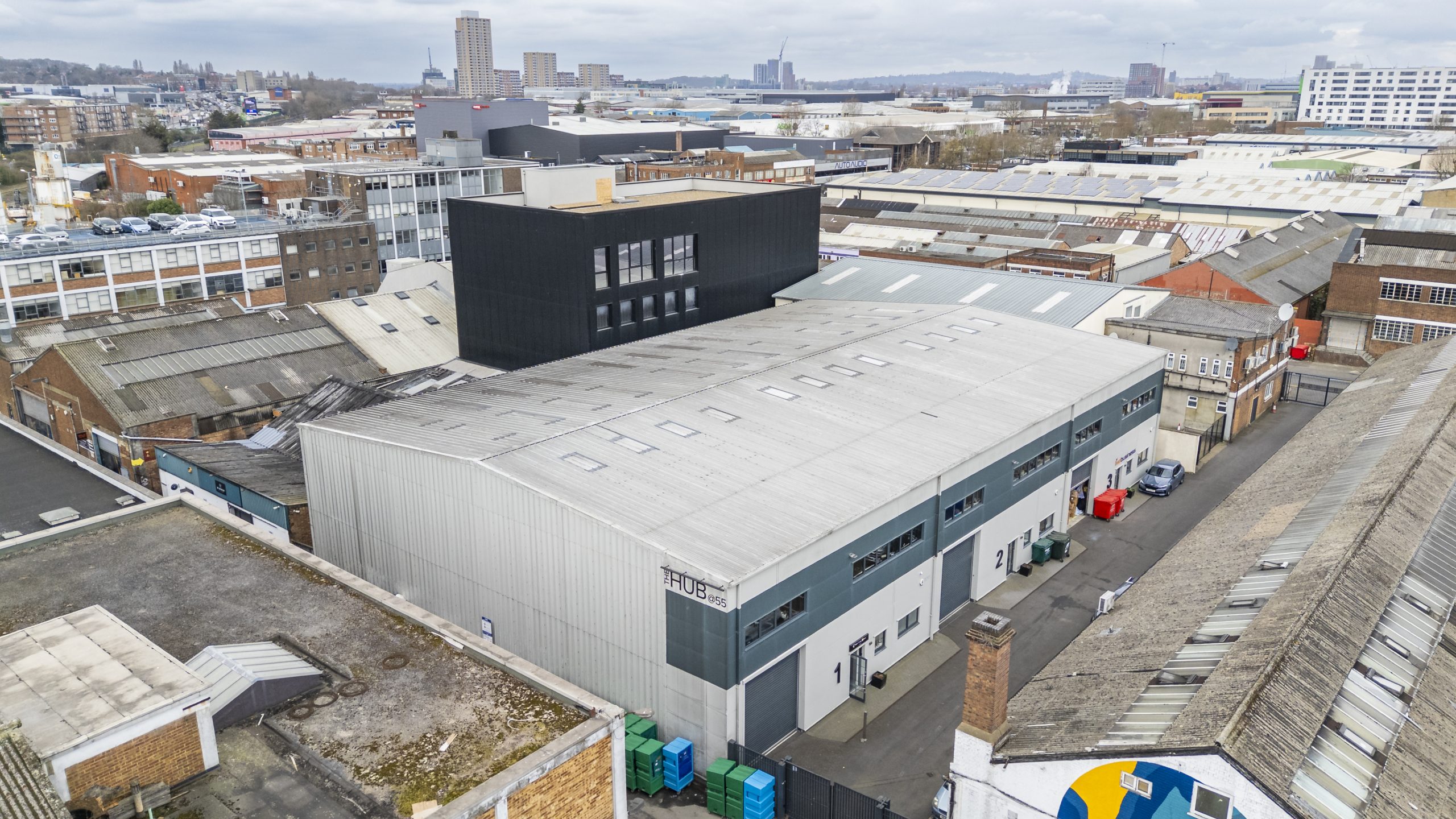 Industrial roof inspection showing large roof areas, rooflights and drainage features